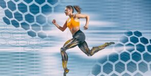 Beautiful female athlete with artificial robotic legs running fast
